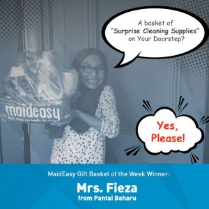 Maideasy team delivering a surprise cleaning supplies gift basket to a customer