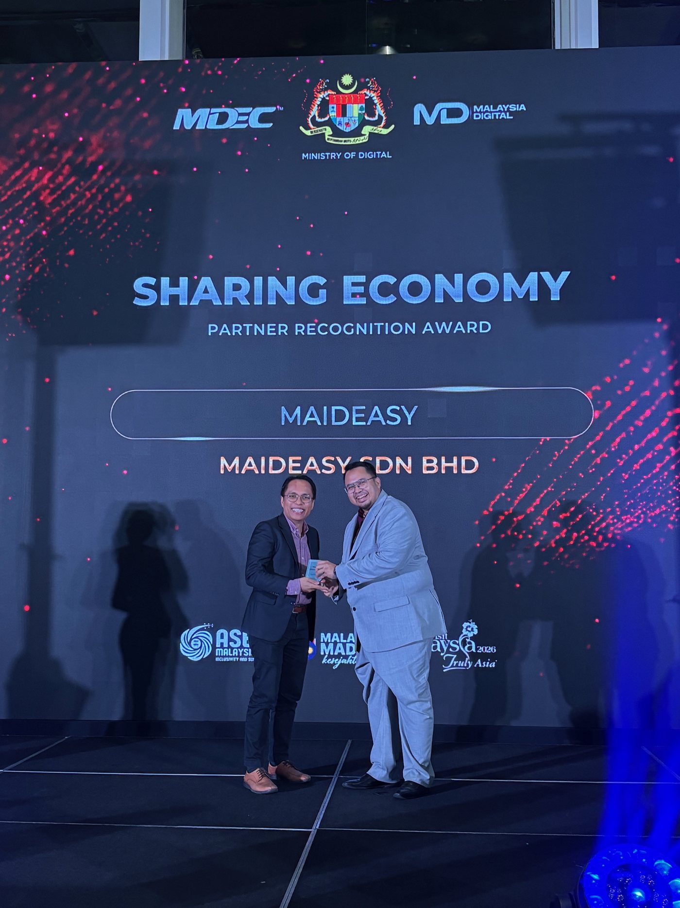 Maideasy receiving the Sharing Economy Partner Recognition Award at an MDEC event